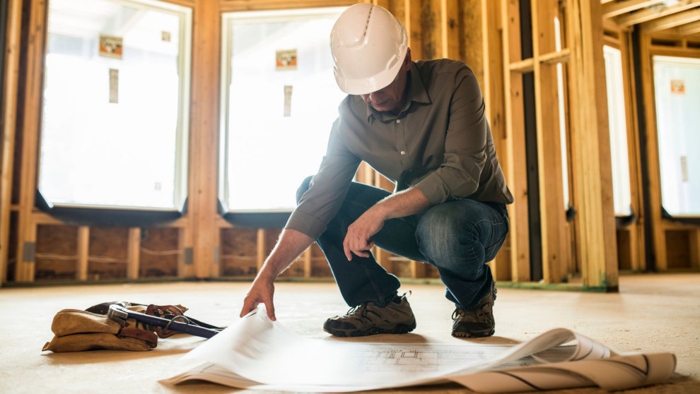 General contractor looking at floor plans