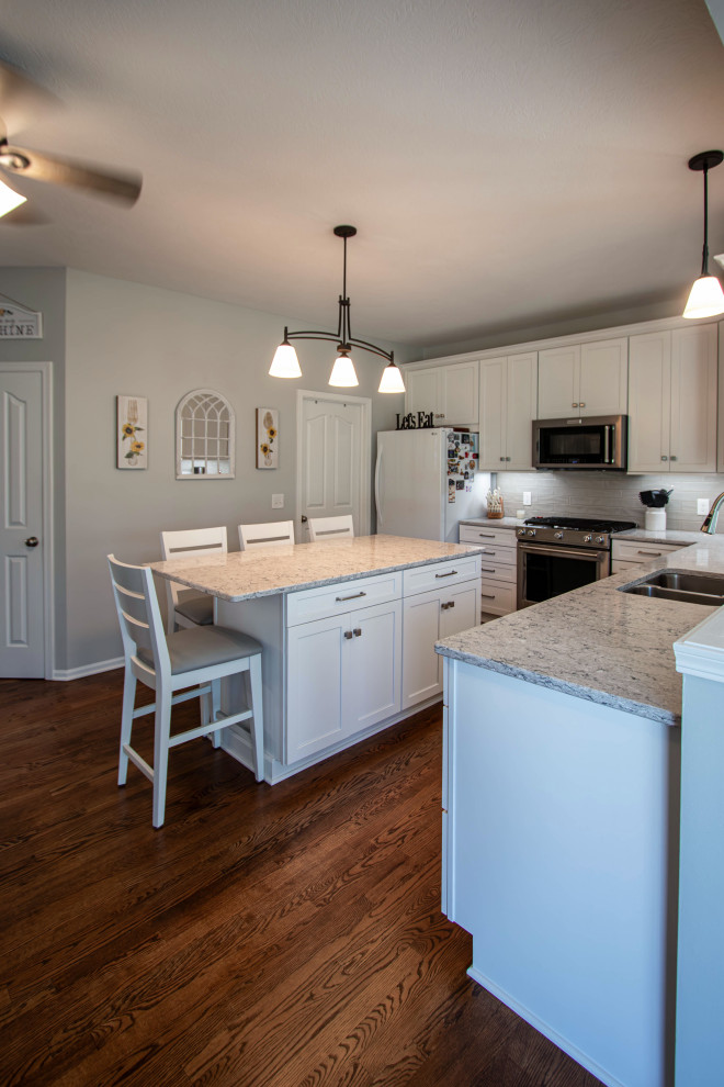 White Shaker Kitchen w/ Pietra Quartz Countertop and Gray Subway Tile ...