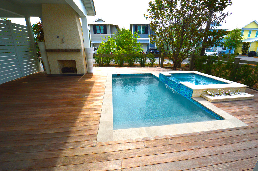 This is an example of a large beach style backyard pool in Miami.