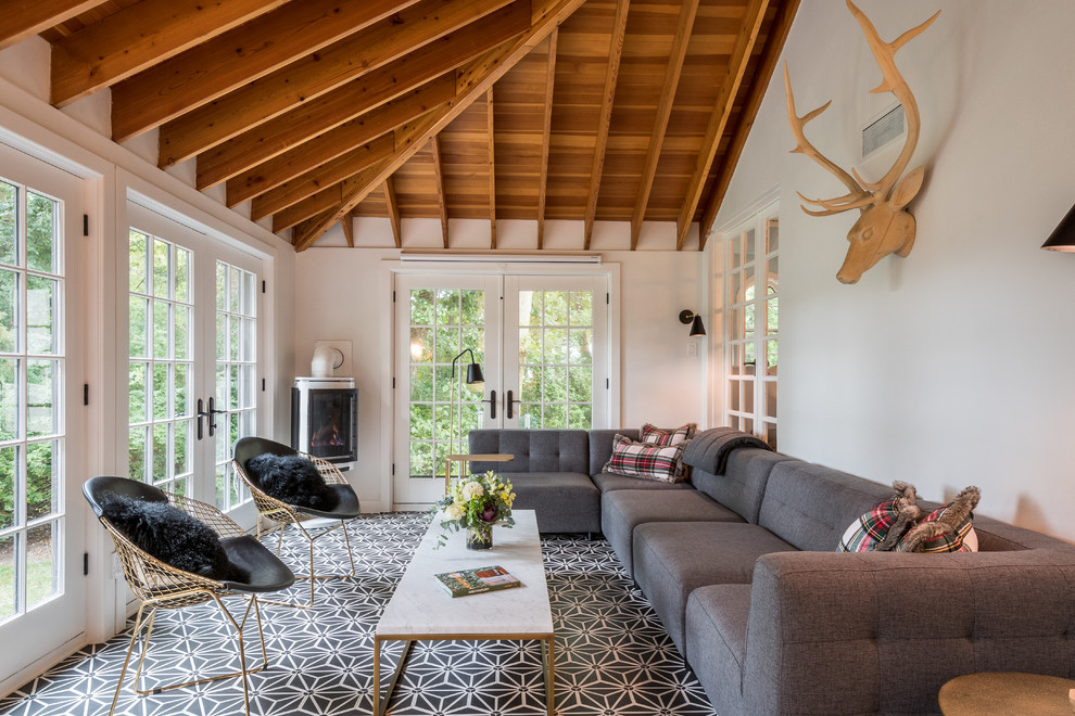 Sunroom - large transitional ceramic tile and multicolored floor sunroom idea with a standard ceiling, a corner fireplace and a metal fireplace