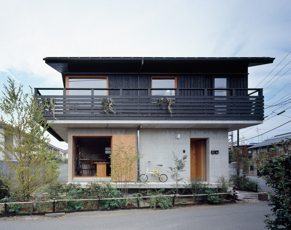 This is an example of an asian multi-coloured exterior in Tokyo Suburbs with a gable roof.
