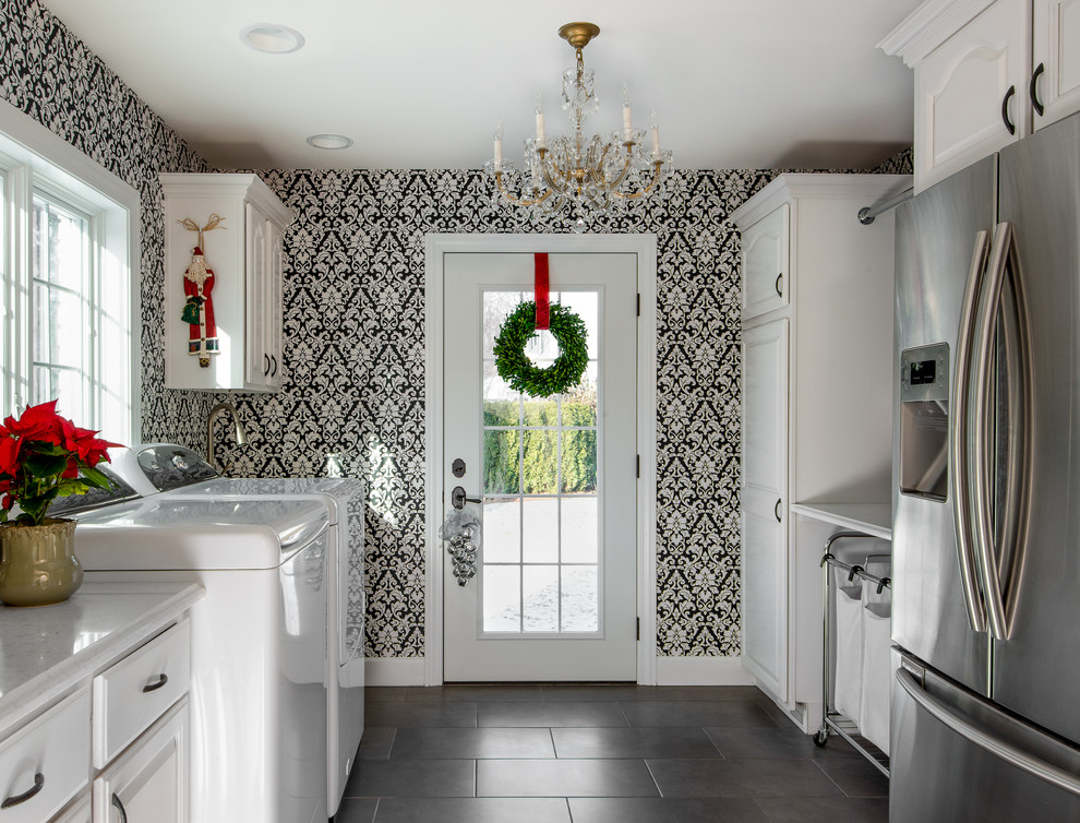 Mid-sized transitional u-shaped gray floor and ceramic tile utility room photo in Detroit with white cabinets, white countertops, raised-panel cabinets, quartz countertops, multicolored walls and a side-by-side washer/dryer