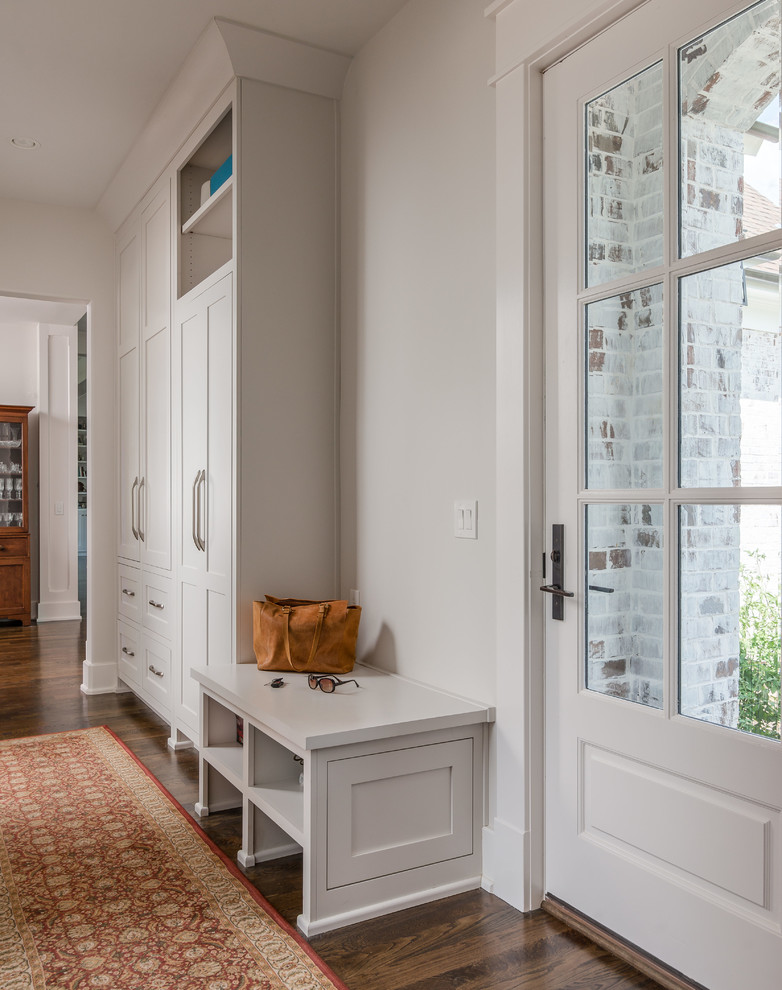Design ideas for a transitional mudroom in Nashville with white walls, dark hardwood floors, a single front door and a white front door.