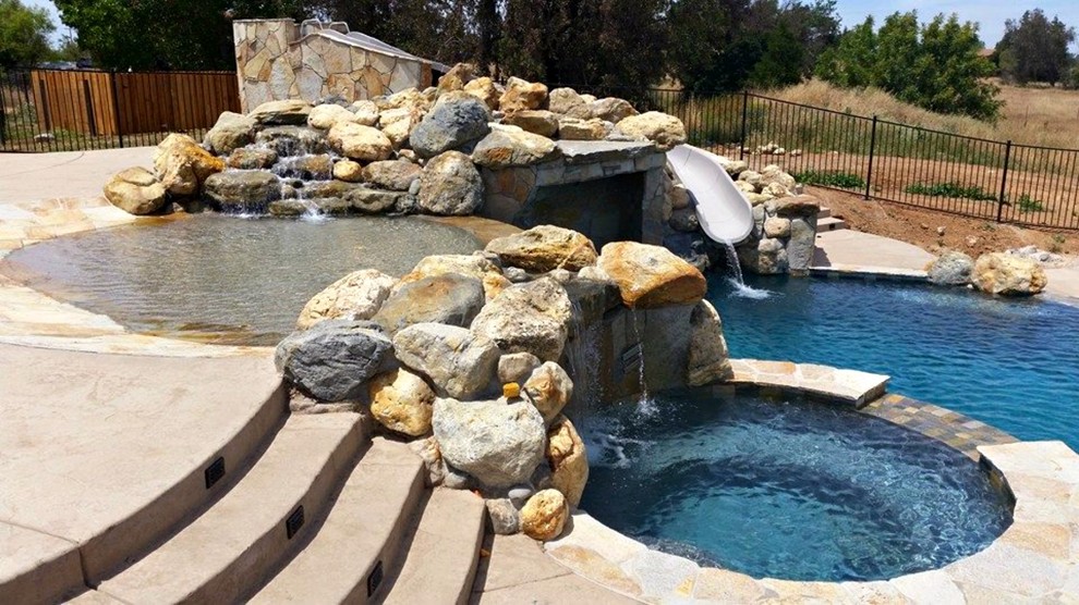 Inspiration for a large transitional backyard custom-shaped and concrete natural water slide remodel in Sacramento