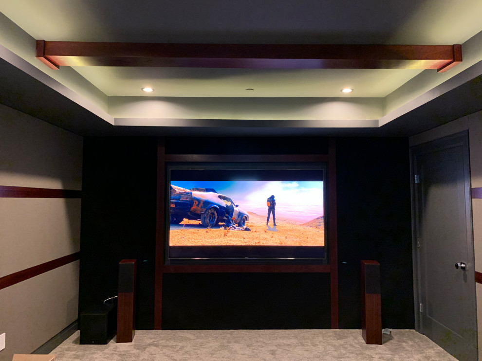 Design ideas for a small traditional enclosed home theatre in DC Metro with beige walls, carpet, a built-in media wall and grey floor.