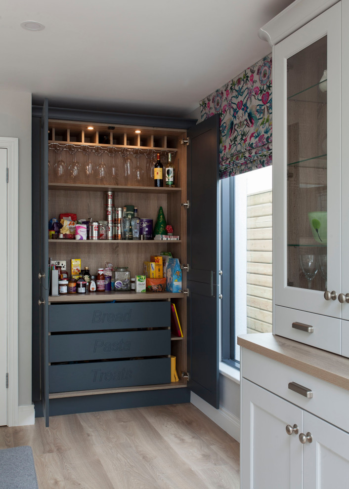 Eat-in kitchen - transitional u-shaped eat-in kitchen idea with shaker cabinets