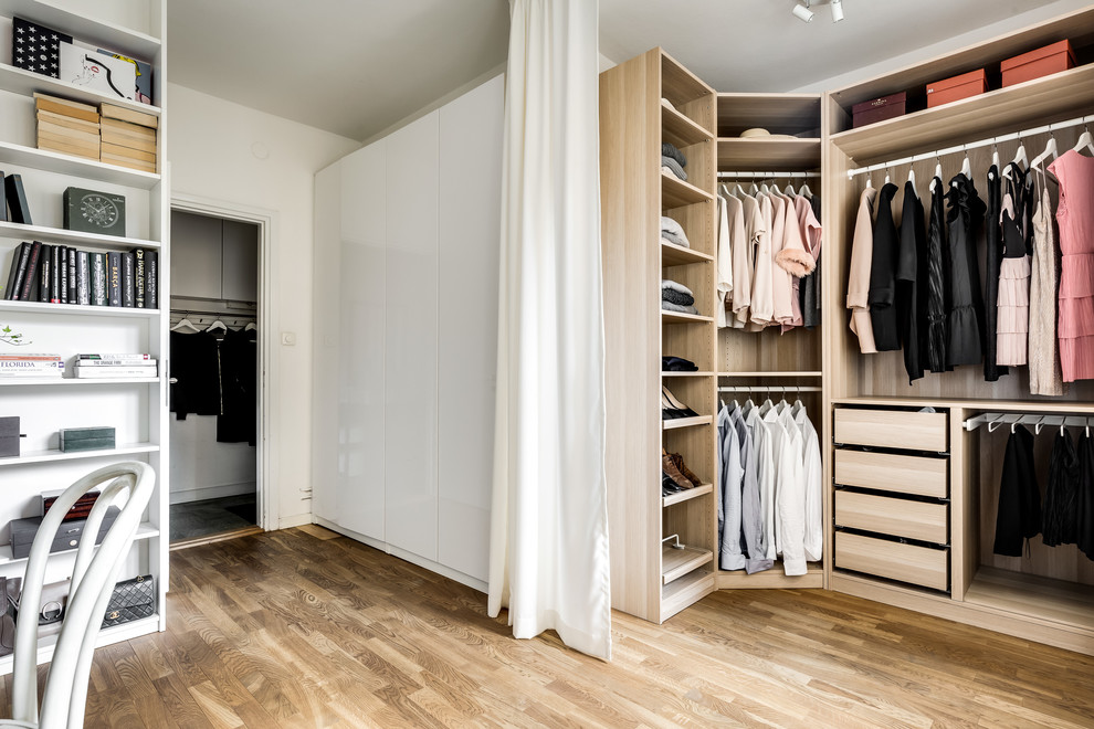 Photo of a transitional storage and wardrobe in Stockholm.