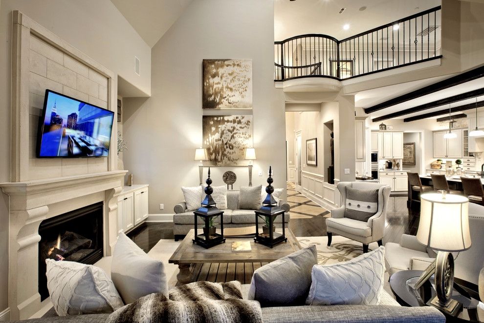 Inspiration for a transitional family room in Charlotte with grey walls.