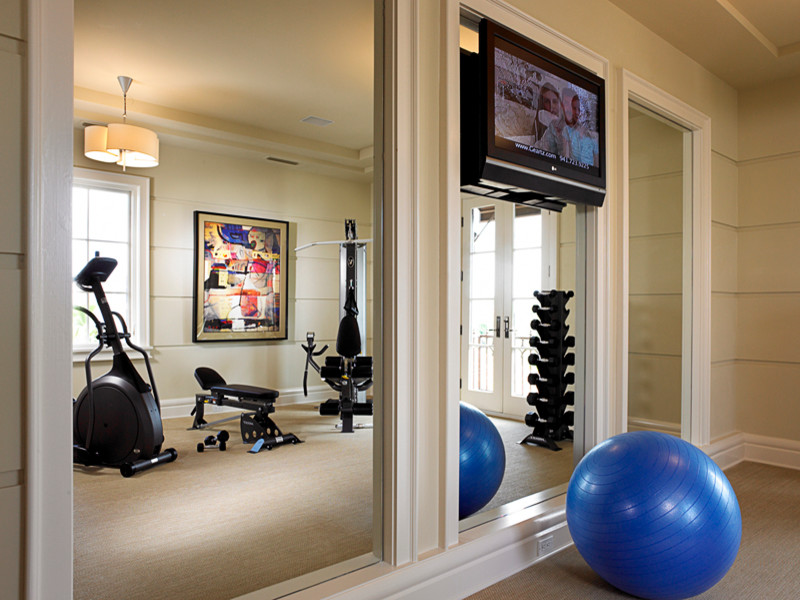 Large transitional multipurpose gym in Tampa with beige walls and carpet.
