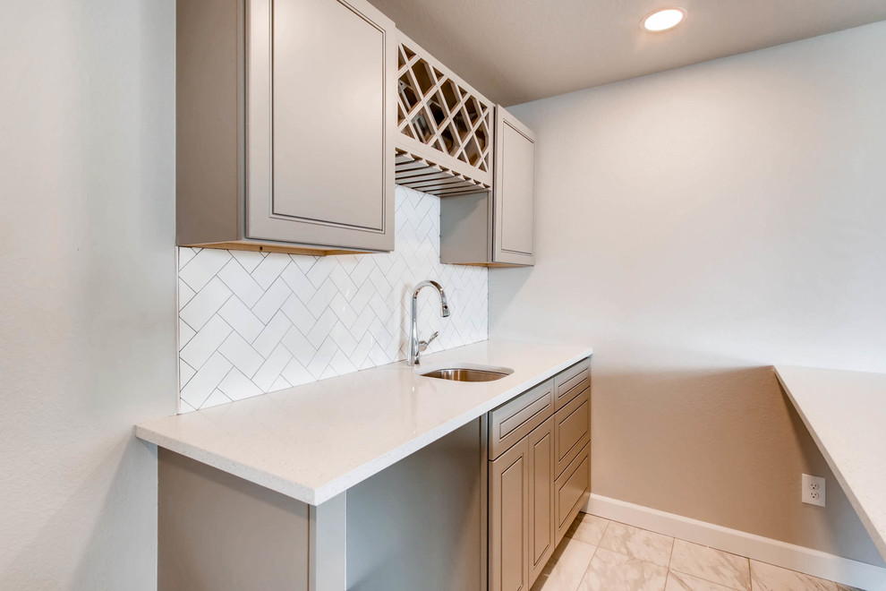 Basement - large underground carpeted and gray floor basement idea in Denver with gray walls and no fireplace