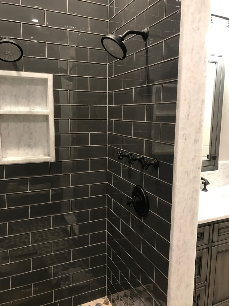 Design ideas for a large transitional master bathroom in Detroit with beaded inset cabinets, grey cabinets, an alcove shower, black tile, subway tile, grey walls, brick floors, an undermount sink, quartzite benchtops and grey floor.