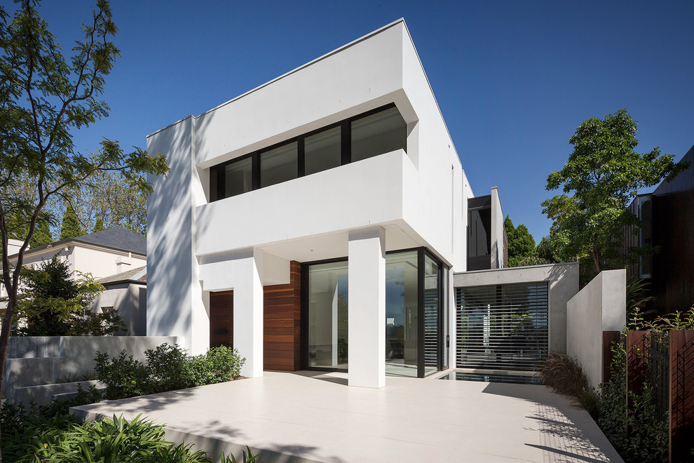 Design ideas for a large contemporary two-storey concrete white exterior in Melbourne.