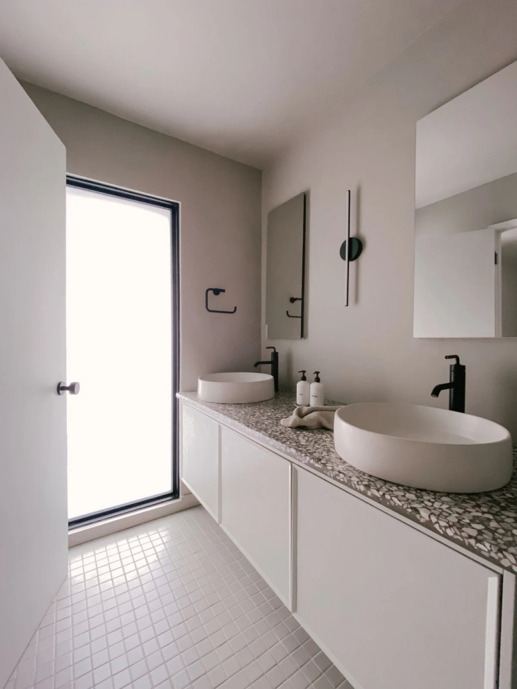 Photo of a contemporary bathroom in Los Angeles with a walk-in shower, grey tiles, ceramic tiles, ceramic flooring and an open shower.