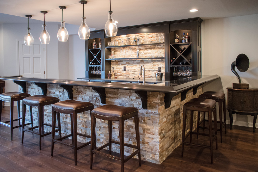 Inspiration for a large traditional home bar in Louisville with medium hardwood floors and brown floor.