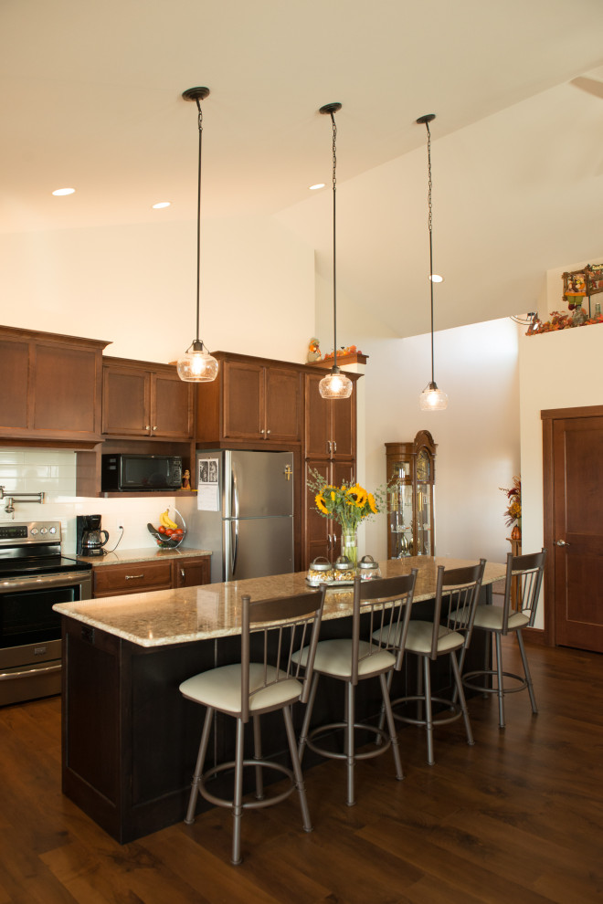 Open concept kitchen - large transitional l-shaped medium tone wood floor open concept kitchen idea with an undermount sink, flat-panel cabinets, medium tone wood cabinets, quartz countertops, white backsplash, ceramic backsplash, stainless steel appliances, an island and multicolored countertops