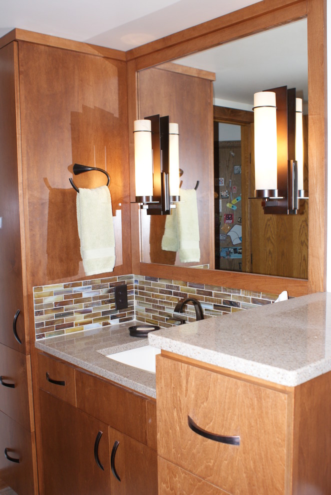 Small contemporary 3/4 bathroom in Minneapolis with an undermount sink, flat-panel cabinets, medium wood cabinets, engineered quartz benchtops, an alcove shower, a one-piece toilet, beige tile, porcelain tile, beige walls and porcelain floors.