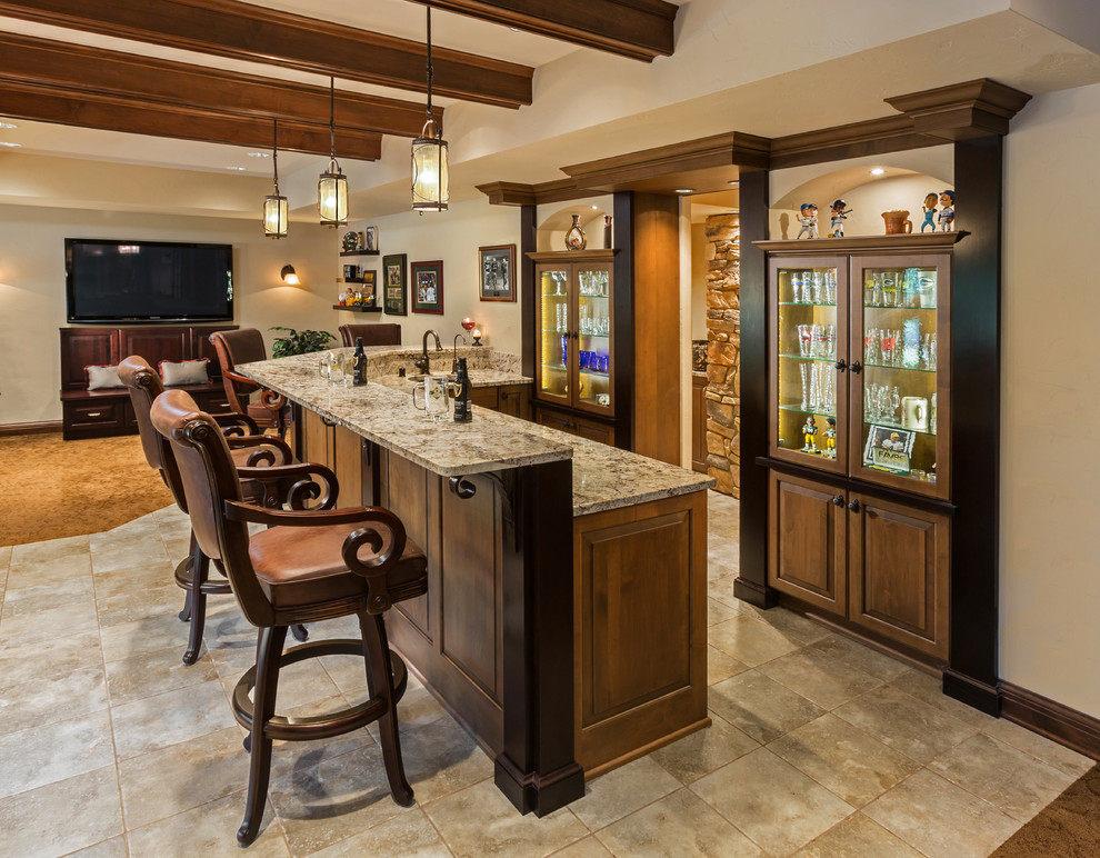 Photo of a mid-sized traditional l-shaped wet bar in Milwaukee with an undermount sink, raised-panel cabinets, medium wood cabinets, granite benchtops and ceramic floors.
