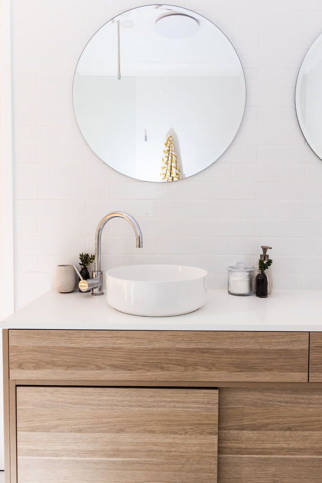 Inspiration for a mid-sized contemporary master wet room bathroom in Canberra - Queanbeyan with light wood cabinets, white tile, subway tile, white walls, porcelain floors, a vessel sink, engineered quartz benchtops, white floor, an open shower and white benchtops.