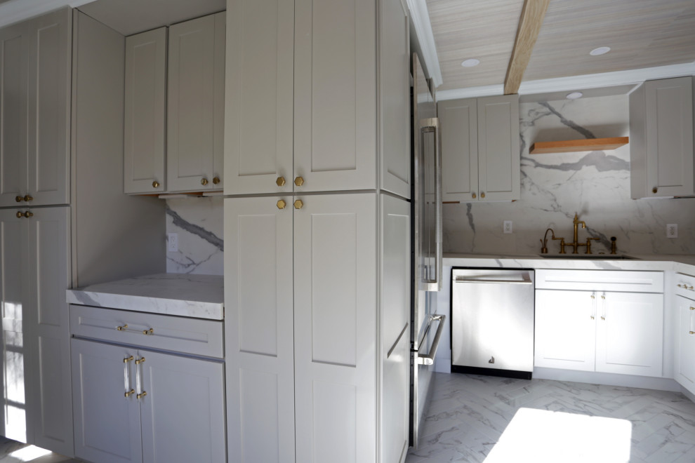 Example of a mid-sized transitional l-shaped marble floor, white floor and exposed beam kitchen design in DC Metro with an undermount sink, shaker cabinets, white cabinets, quartzite countertops, white backsplash, quartz backsplash and stainless steel appliances