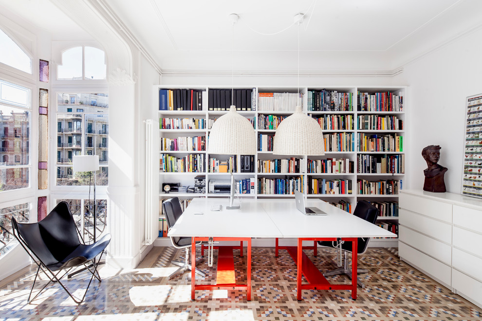 This is an example of a mid-sized contemporary study room in Barcelona with white walls, a freestanding desk, ceramic floors and no fireplace.