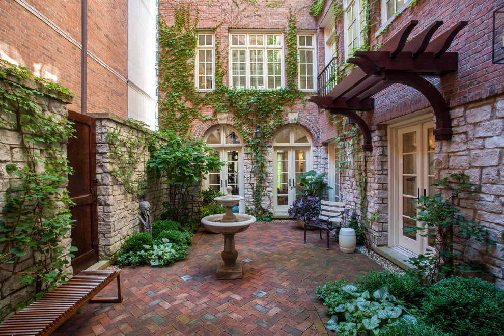 Design ideas for a small traditional courtyard partial sun formal garden for summer in Chicago.