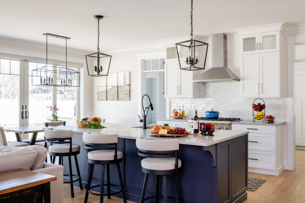 Transitional kitchen photo in Providence with an undermount sink, shaker cabinets, quartzite countertops, subway tile backsplash and an island