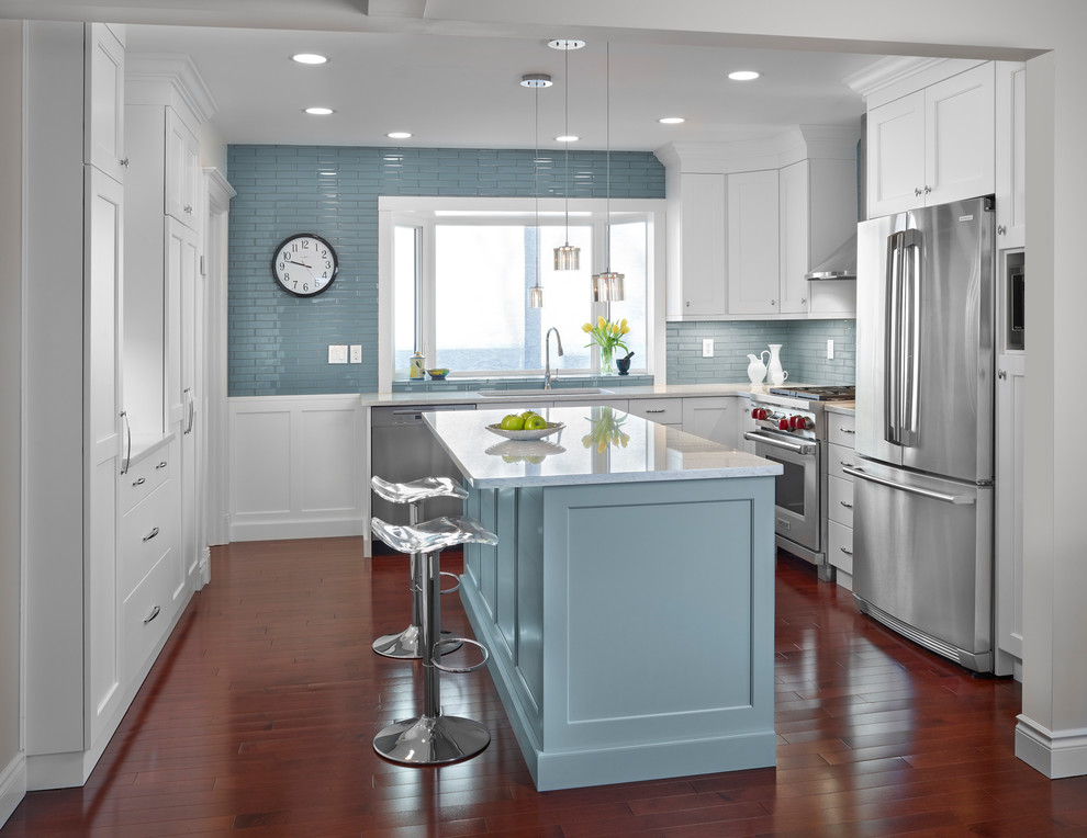 Eat-in kitchen - small transitional u-shaped dark wood floor and brown floor eat-in kitchen idea in Edmonton with an undermount sink, shaker cabinets, white cabinets, quartz countertops, blue backsplash, subway tile backsplash, stainless steel appliances and an island