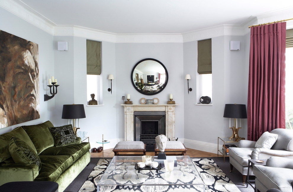 This is an example of a mid-sized traditional formal open concept living room in London with white walls, carpet, a standard fireplace, a stone fireplace surround and a concealed tv.