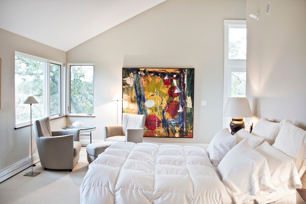 Inspiration for a contemporary master bedroom in Portland Maine with beige walls, carpet and no fireplace.