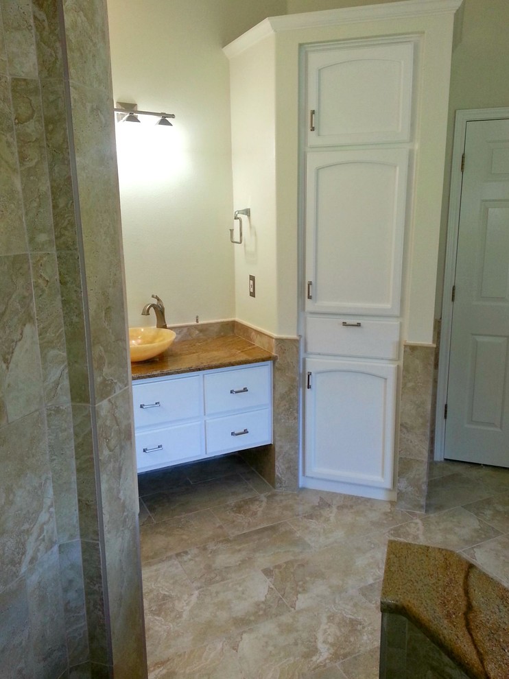 Inspiration for a large transitional master beige tile and ceramic tile ceramic tile and beige floor bathroom remodel in Austin with flat-panel cabinets, white cabinets, beige walls and a vessel sink