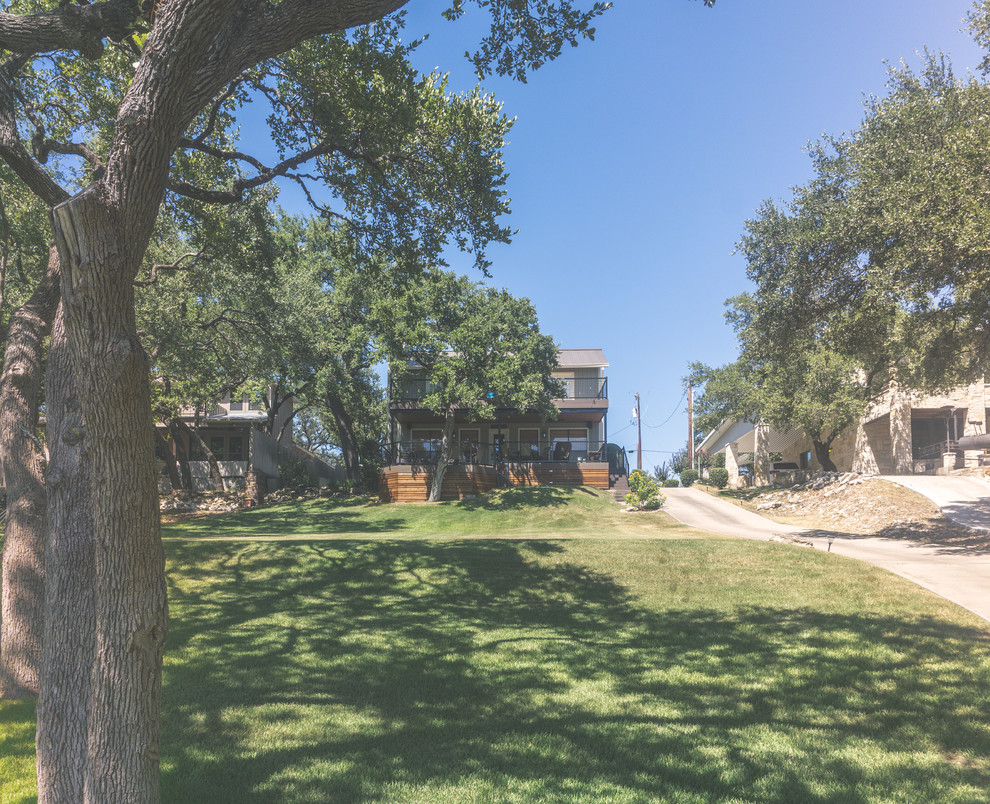 Deck - large rustic backyard balcony deck idea in Austin