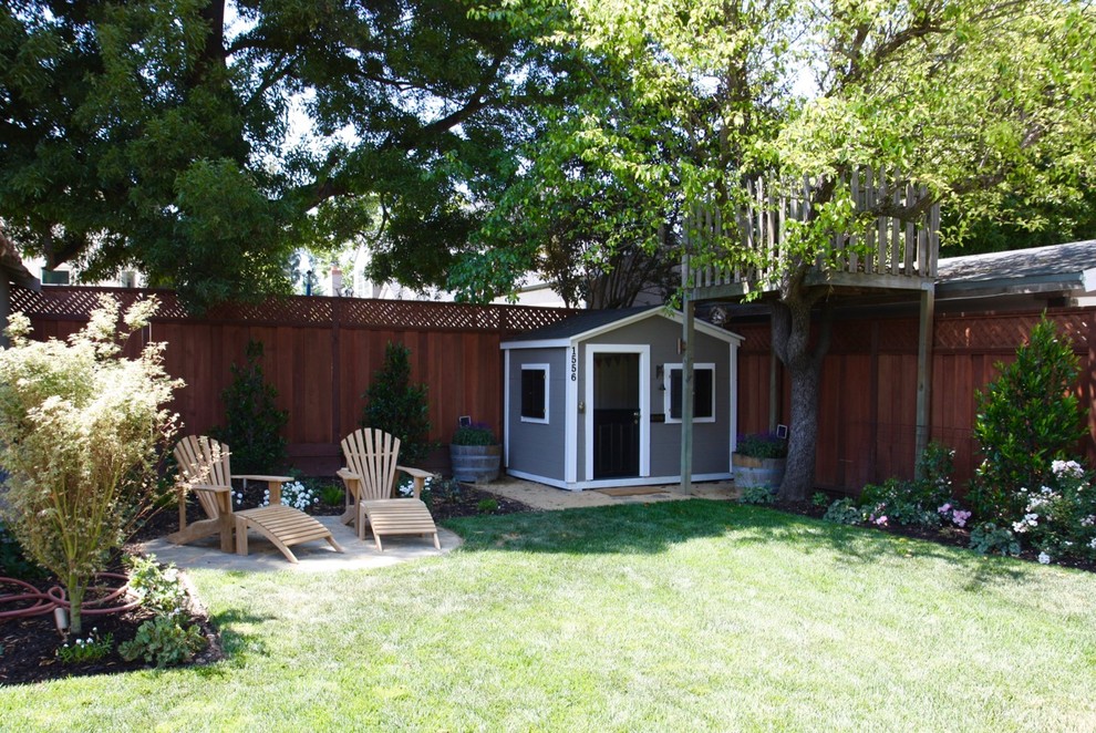 Photo of a mid-sized traditional backyard xeriscape in San Francisco with with outdoor playset and natural stone pavers.