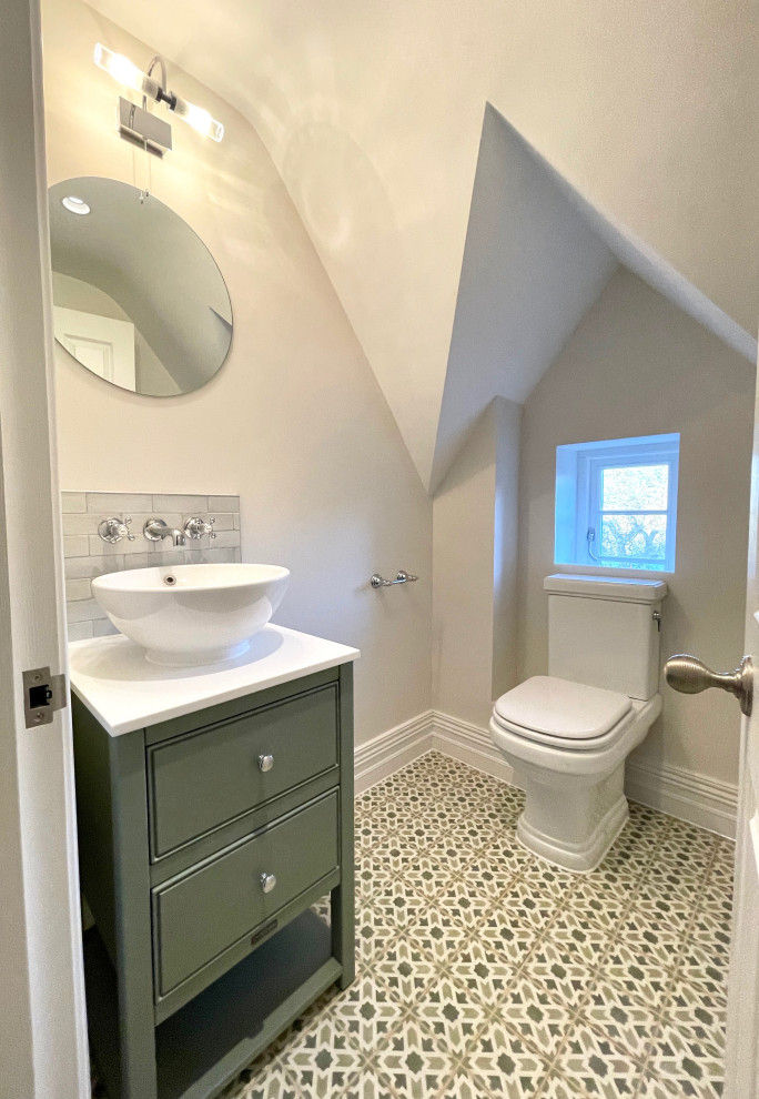Small traditional bathroom in Hertfordshire with green cabinets, a single sink and a freestanding vanity unit.