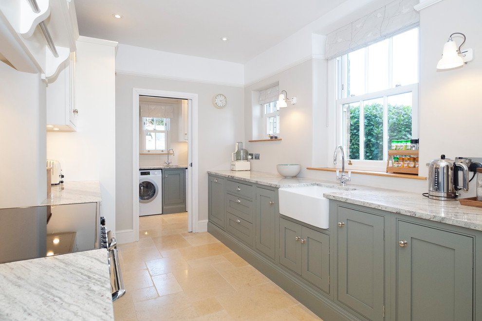 Small traditional galley separate kitchen in Cardiff with a farmhouse sink, shaker cabinets, green cabinets, granite benchtops, beige floor and grey benchtop.