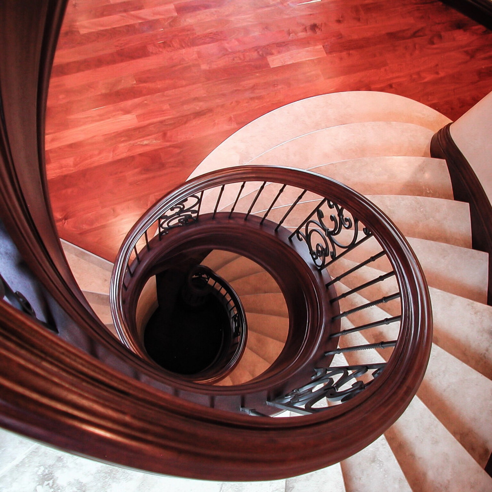 Design ideas for a mid-sized traditional spiral staircase in Salt Lake City with wood railing.