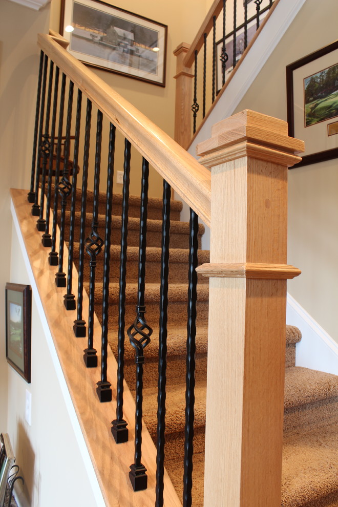 Inspiration for a traditional carpeted u-shaped staircase in Other with carpet risers.