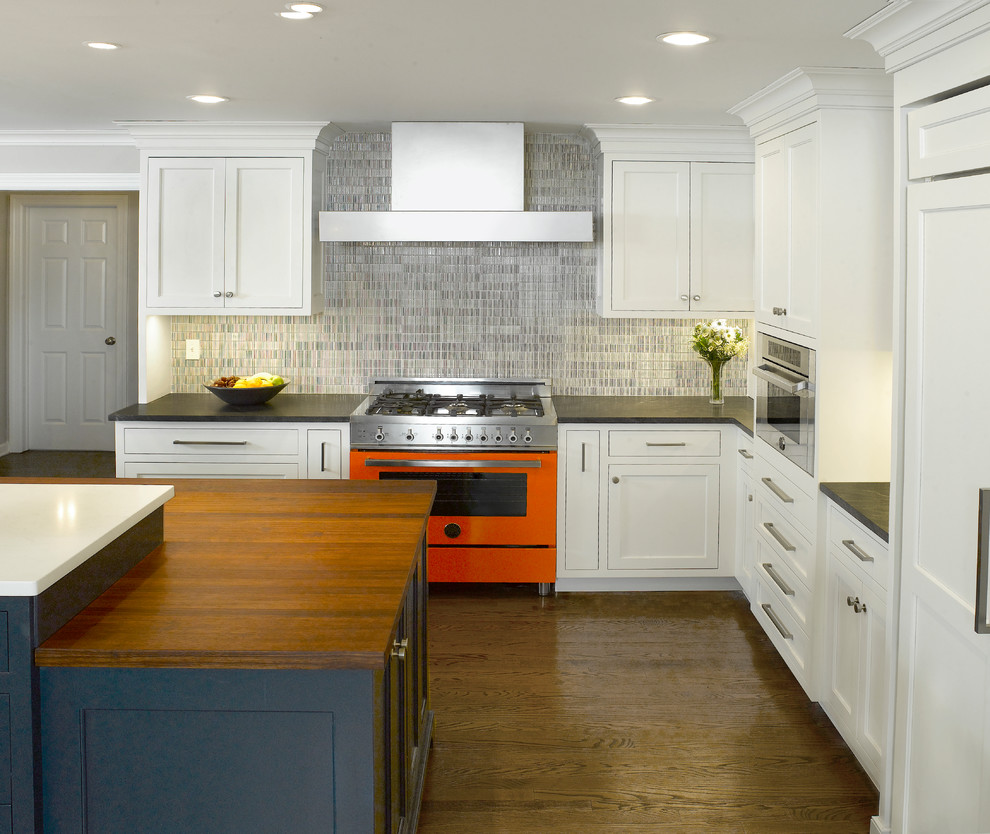 Design ideas for a transitional kitchen in New York with white cabinets, ceramic splashback and with island.