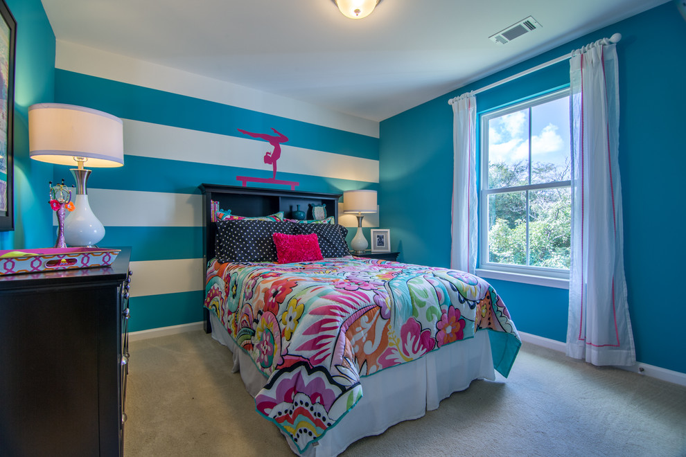 Photo of a transitional kids' room for girls in Other with carpet and multi-coloured walls.