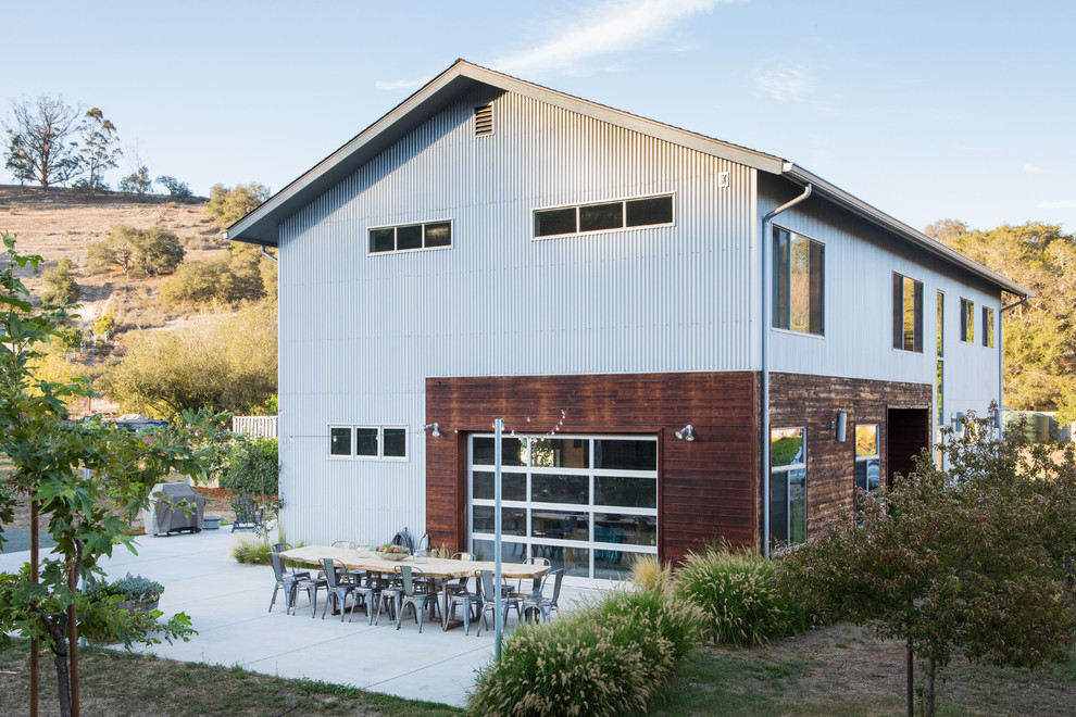 Photo of a country two-storey exterior in San Luis Obispo with mixed siding and a gable roof.