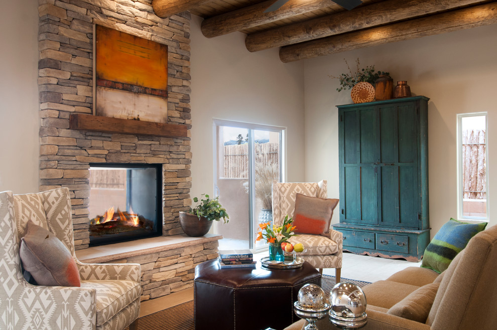 Design ideas for a mid-sized open concept living room in Albuquerque with beige walls, a two-sided fireplace, a stone fireplace surround and no tv.