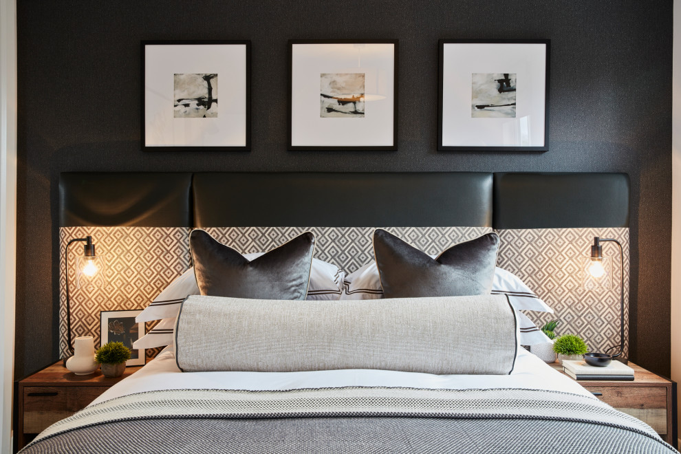 Inspiration for a mid-sized contemporary master bedroom in London with black walls.