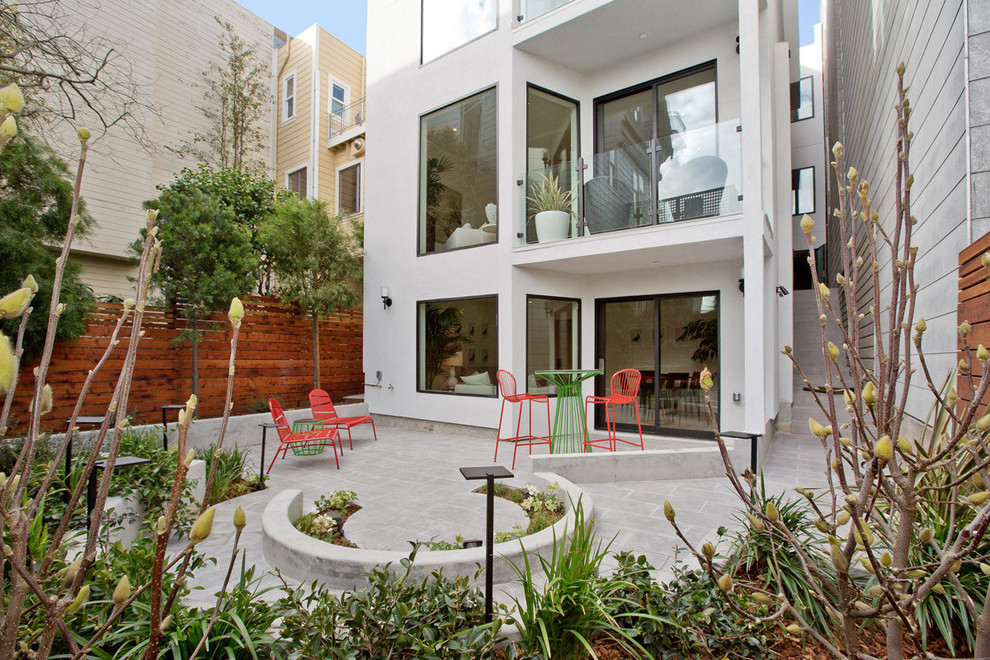 Small contemporary backyard partial sun formal garden in San Francisco with natural stone pavers.