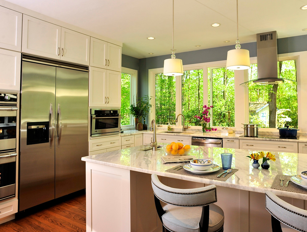 Kitchen - large transitional u-shaped medium tone wood floor kitchen idea in DC Metro with an undermount sink, shaker cabinets, white cabinets, granite countertops, stainless steel appliances and an island