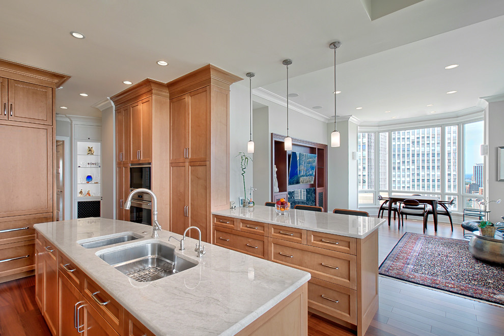 Inspiration for a transitional kitchen remodel in Chicago with recessed-panel cabinets and medium tone wood cabinets