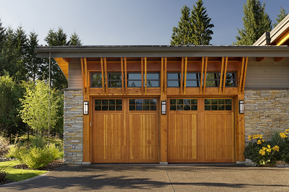 Design ideas for a mid-sized country attached two-car garage in Vancouver.
