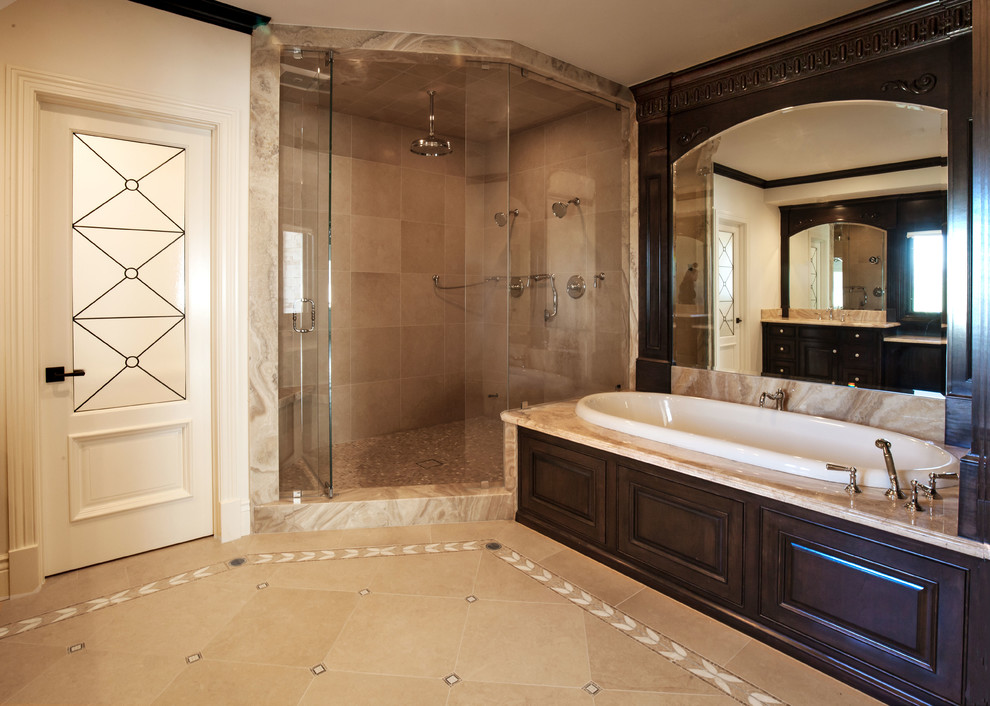 Design ideas for a mid-sized traditional master bathroom in Los Angeles with an undermount sink, raised-panel cabinets, dark wood cabinets, onyx benchtops, a drop-in tub, an alcove shower, a two-piece toilet, beige tile, mosaic tile, white walls and mosaic tile floors.