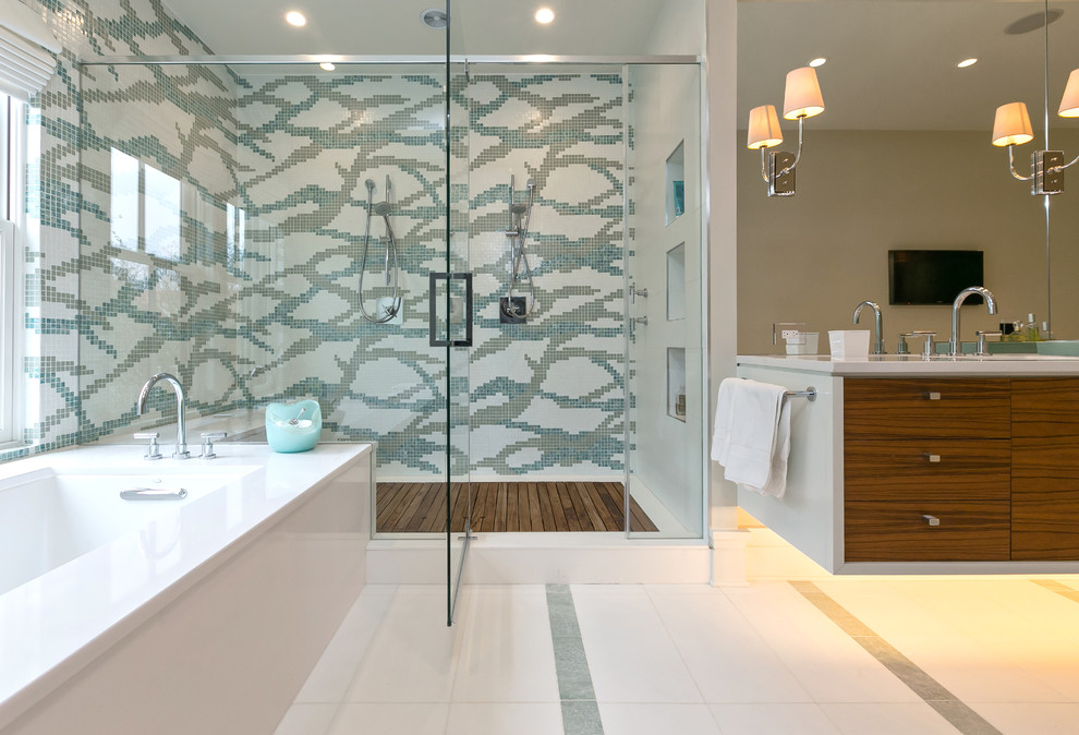 Inspiration for a contemporary master bathroom in Charleston with flat-panel cabinets, medium wood cabinets, an undermount tub, a double shower, multi-coloured tile and mosaic tile.