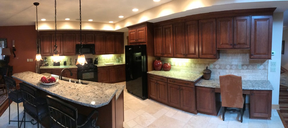 This is an example of a large arts and crafts eat-in kitchen in Other with an undermount sink, recessed-panel cabinets, medium wood cabinets, quartzite benchtops, beige splashback, stone tile splashback, black appliances, travertine floors and with island.