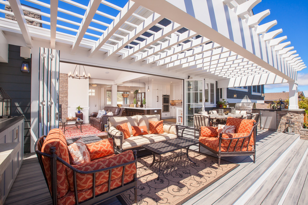 Inspiration for a mid-sized transitional backyard patio in San Francisco with an outdoor kitchen, decking and a pergola.