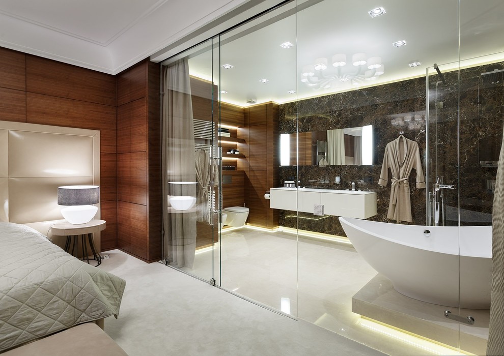 Photo of a contemporary master bathroom in Moscow with flat-panel cabinets, white cabinets, a freestanding tub, a corner shower, a wall-mount toilet, brown tile and brown walls.